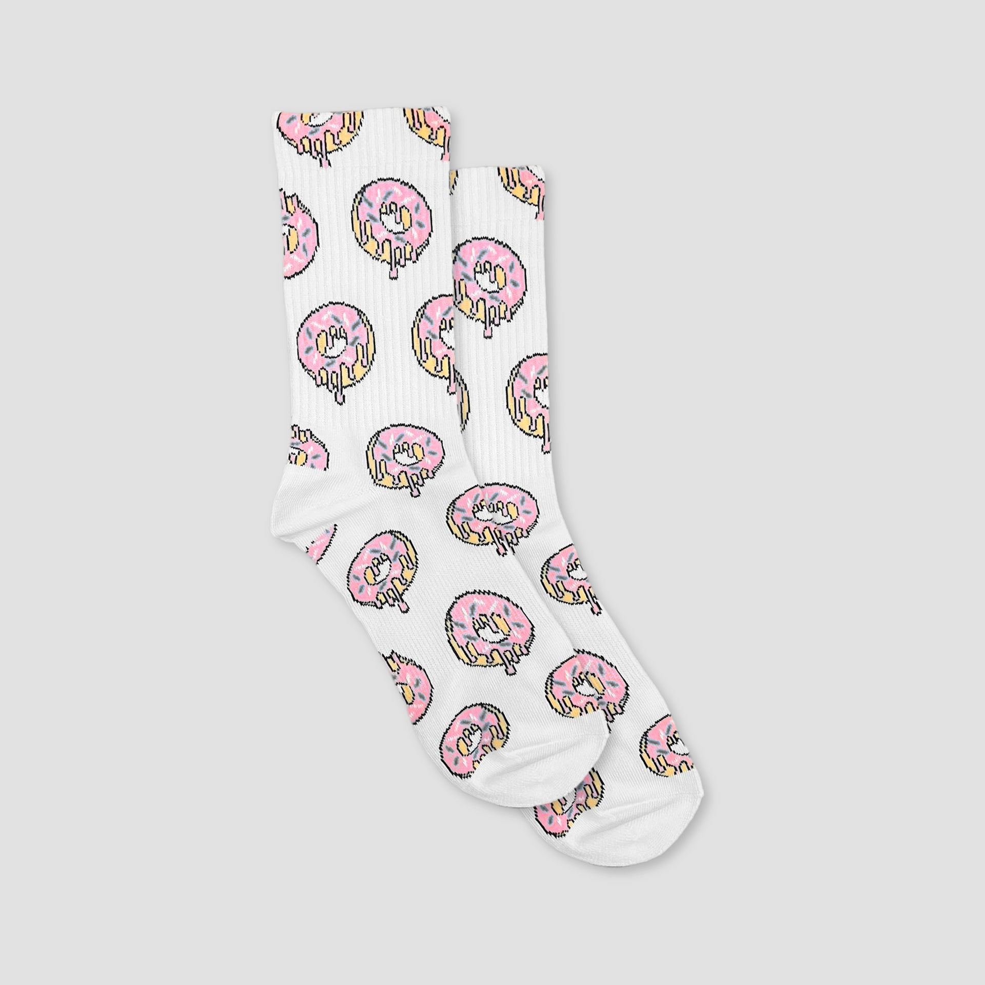 A pair of white crew socks with an all-over pink frosted donut print, displayed against a solid light gray background.