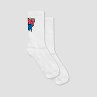 A pair of white ribbed crew socks with a colorful graffiti-style graphic on the cuff, displayed against a solid light gray background.