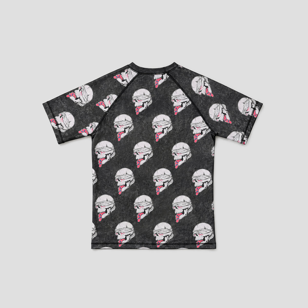 A short-sleeve raglan t-shirt with a dark gray, distressed texture, featuring an all-over print of white and black helmet characters with pink accents.