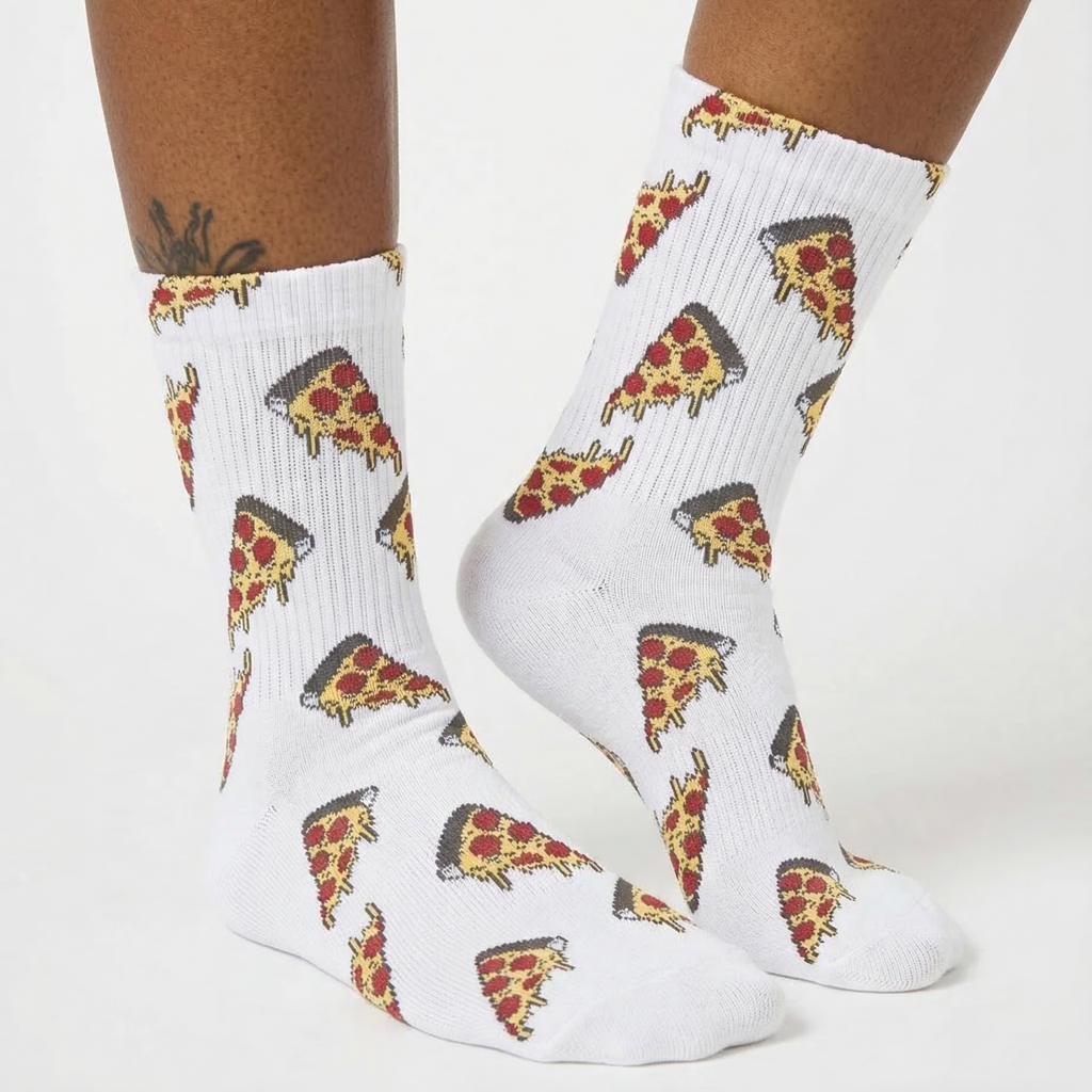 White crew socks with an all-over pizza slice print, shown on a model's feet against a clean white background.