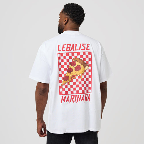A man wearing a white oversized t-shirt, viewed from the back. The shirt features a large graphic print of a pepperoni pizza slice on a red and white checkered square, with the words 'LEGALISE' above and 'MARINARA' below in red.