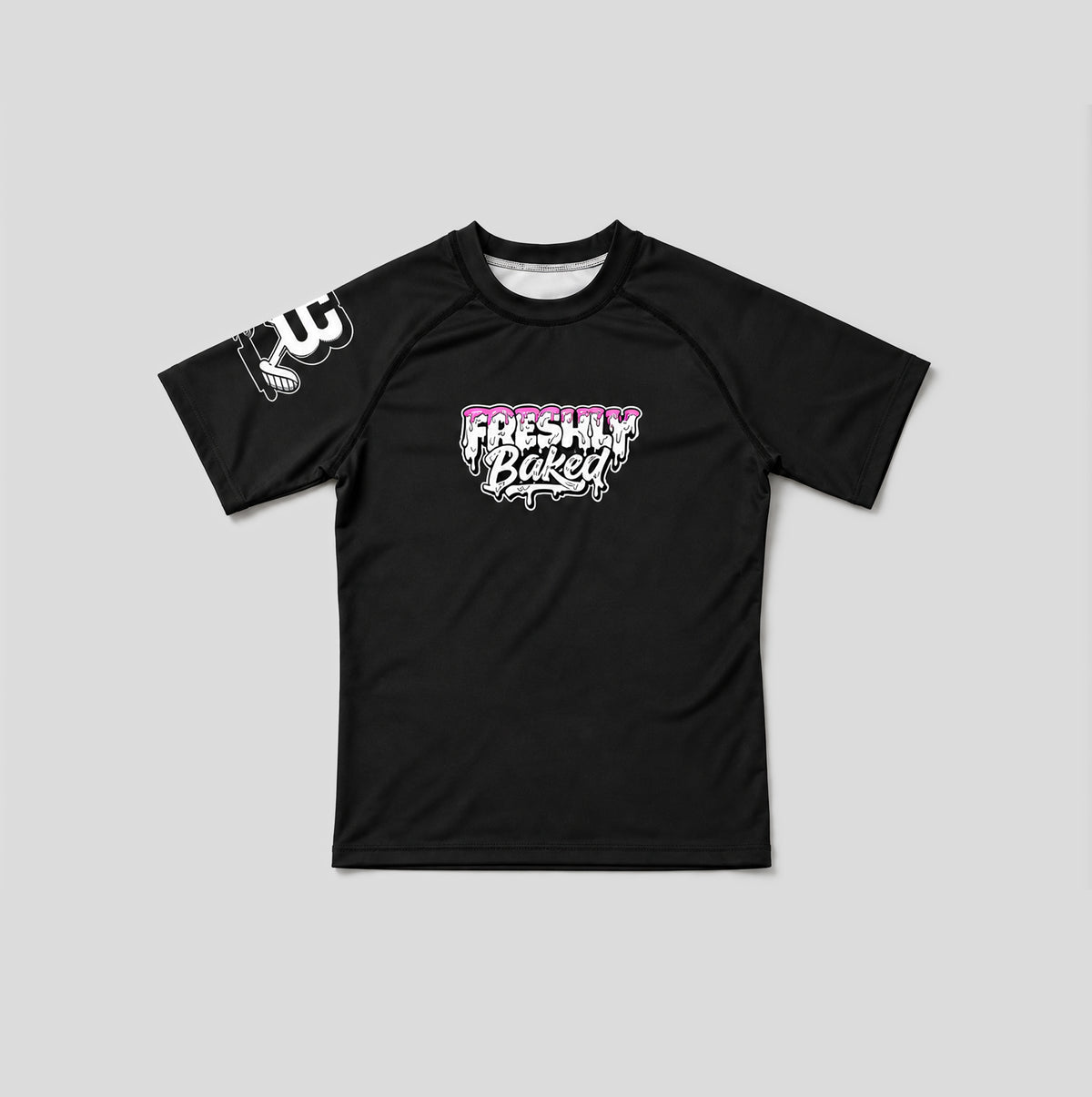 A black short-sleeve athletic t-shirt with a 'Freshly Baked' graphic in pink and white on the chest, and a white graphic on the right sleeve, displayed flat against a light gray background.
