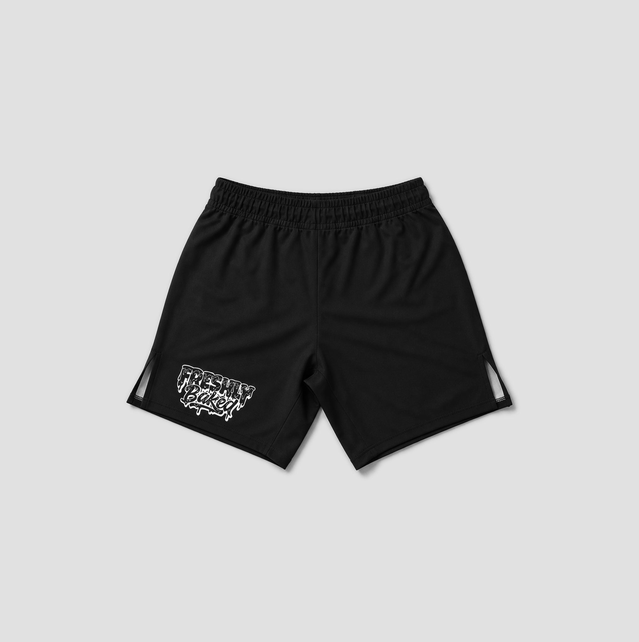 Black athletic shorts with an elastic waistband, featuring a white graphic logo on the left leg and white side cutout details, displayed against a light gray background.