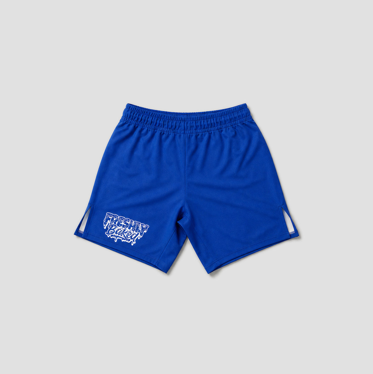 Royal blue athletic shorts with an elastic waistband, featuring a white graphic print on the lower left leg and white side accents, displayed on a light gray background.