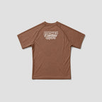 A brown short-sleeve athletic t-shirt with a white 'Freshly Baked' graphic printed on the upper chest, displayed flat against a light gray background.