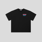 A black short-sleeve crewneck t-shirt with a colorful graphic on the left chest reading 'FRESHLY WASHED' in pink and blue, displayed on a neutral gray background.