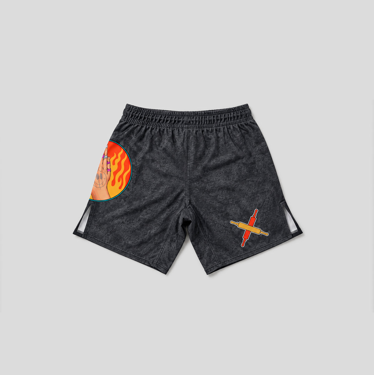 Dark gray heathered athletic shorts with a circular orange and yellow flame graphic on the left leg and a small red and yellow graphic on the right leg, shown against a light gray background.
