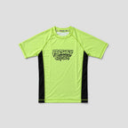 A neon yellow-green short-sleeve athletic t-shirt with black side panels and a black 'Freshly Baked' logo on the chest, displayed flat against a light gray background.