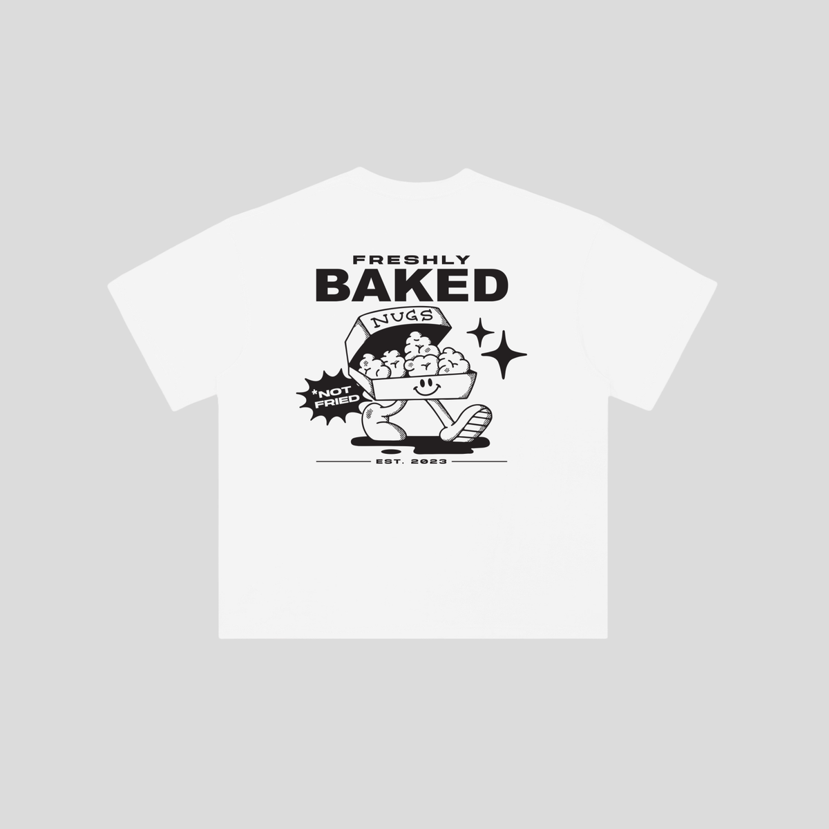 A white short-sleeve t-shirt with a black graphic print on the front. The graphic features the text 'FRESHLY BAKED' above a cartoon character sitting in a hot dog bun with a speech bubble that says 'NOT FRIED'.
