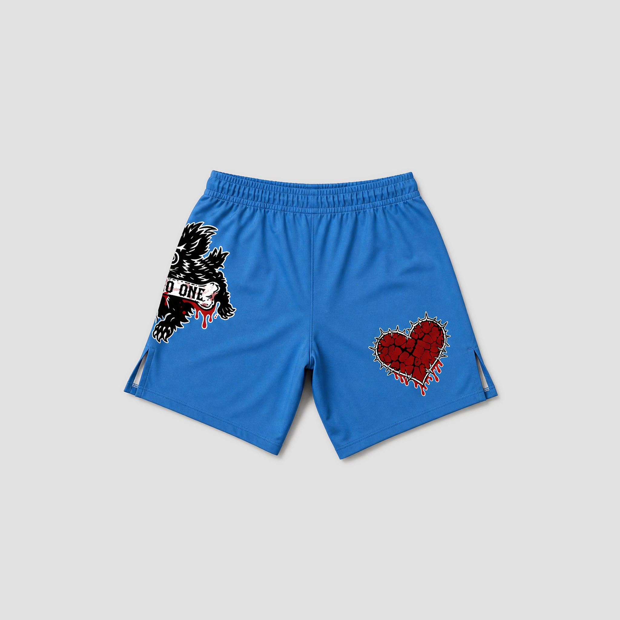 Blue athletic shorts with a black and white eagle graphic and red text on the left leg, and a red cracked heart graphic on the right leg, shown on a light gray background.