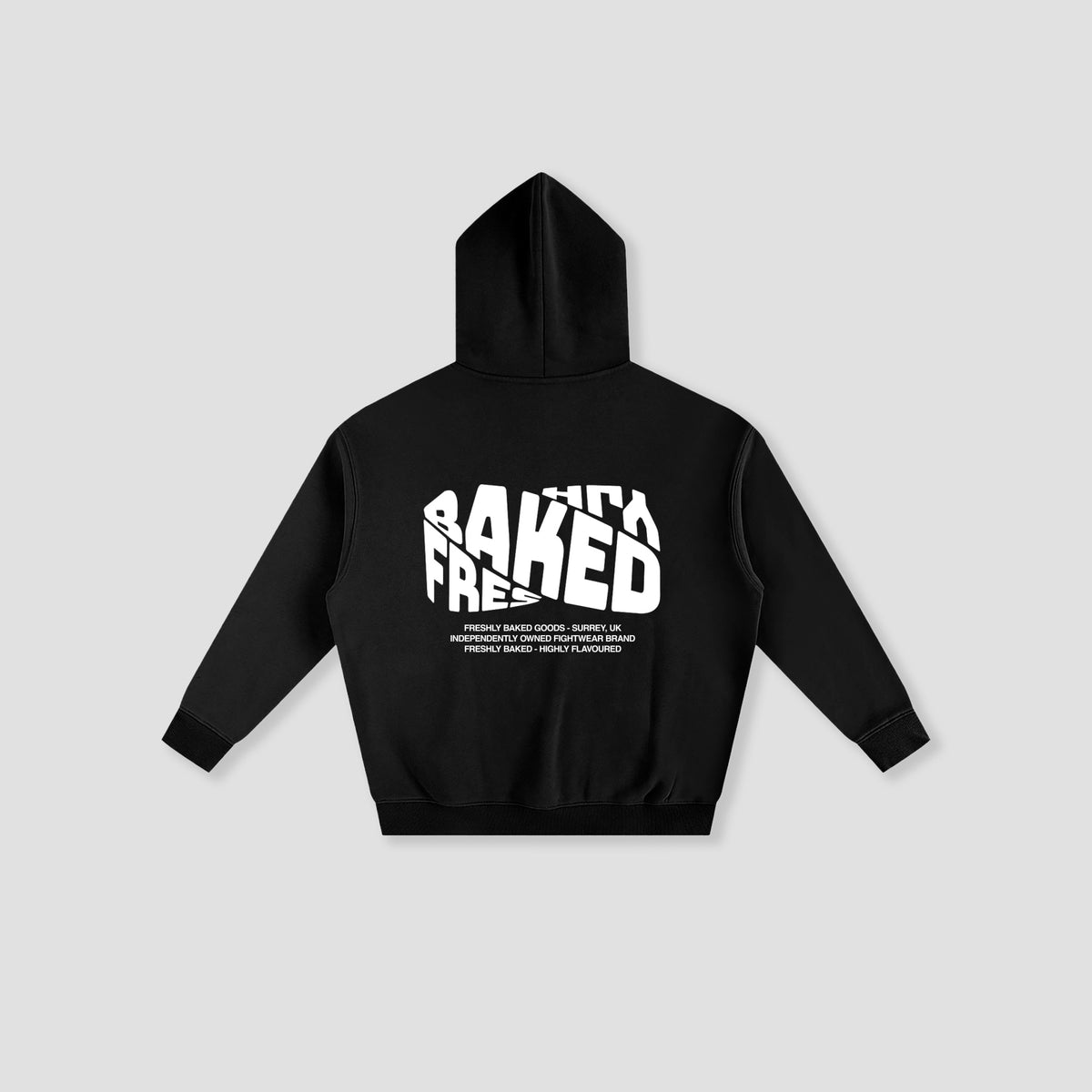 A black long-sleeve hoodie shown from the back, featuring a bold white graphic print that reads  Freshly BAKED with smaller text underneath, displayed on a light gray background.