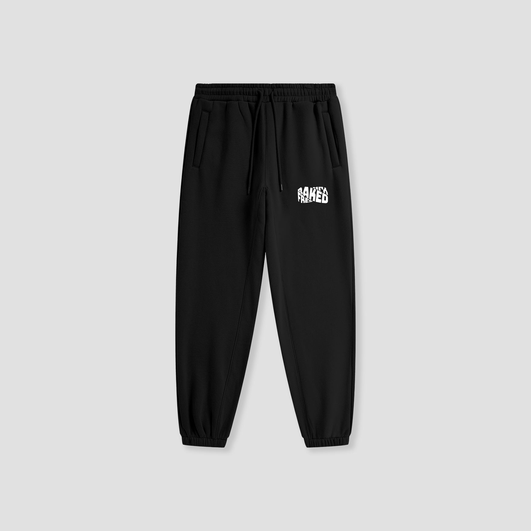 Black jogger pants with a logo on the pocket against a light gray background