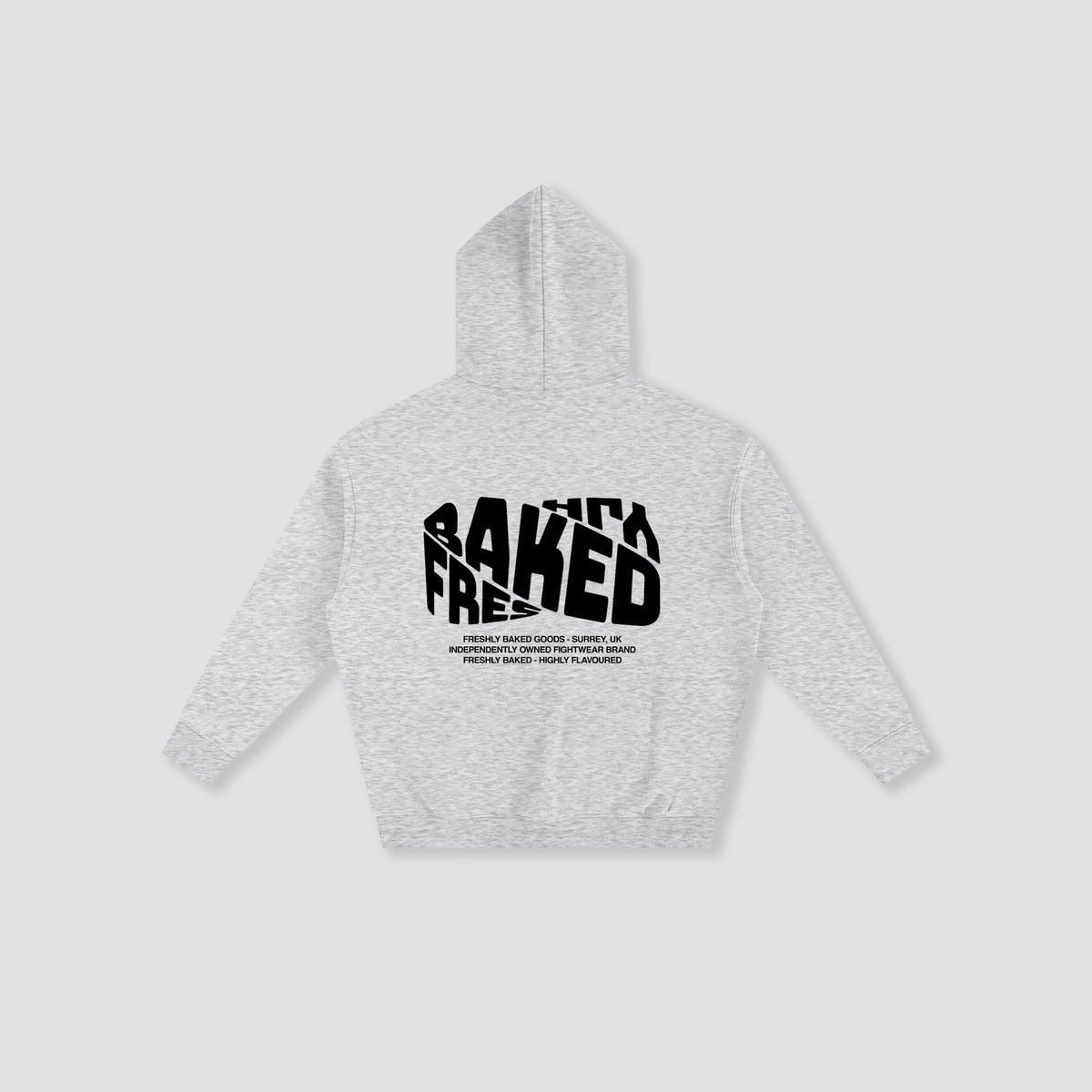 A light heather gray hoodie shown from the back, featuring a bold black graphic print that reads 'FRESHLY BAKED' with smaller text underneath, displayed on a neutral light gray background.