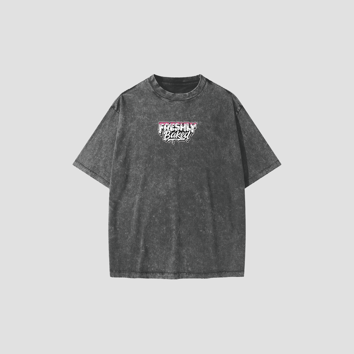 A dark gray acid-wash t-shirt with a 'Freshly Baked' graphic on the chest, displayed against a solid light gray background.