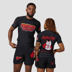 A man and a woman modeling matching black rash guard shirts and shorts with red and white graphics. The man shows the front of the shirt with 'Fresh Kid' text, and the woman shows the back of the shirt with a 'Lucky Cat' graphic.