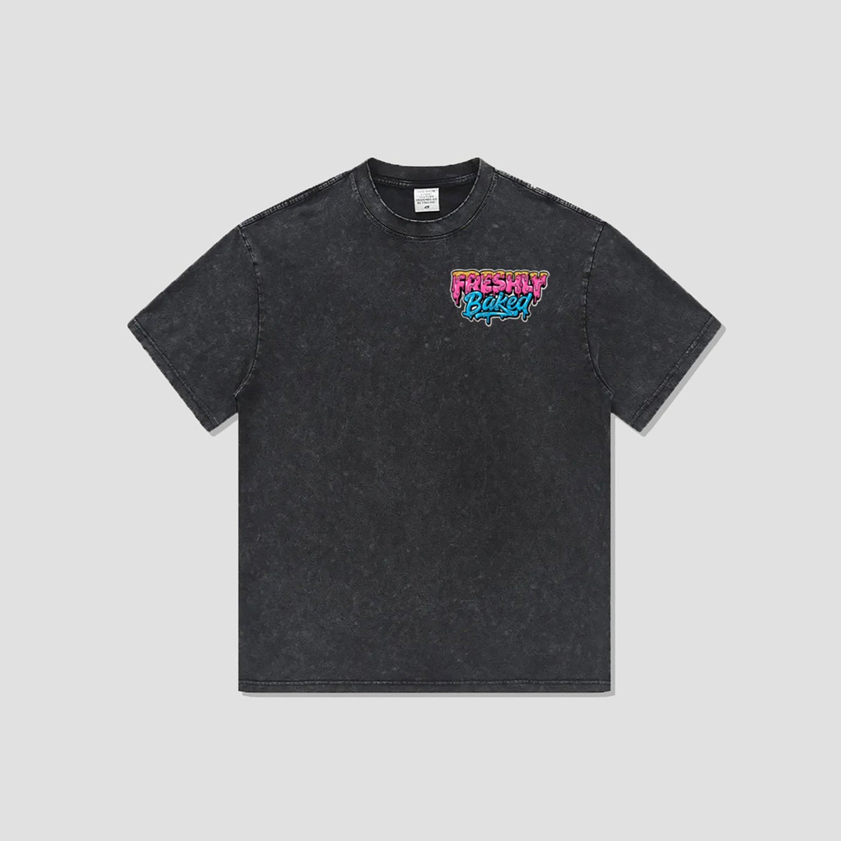 A dark gray acid-wash t-shirt with a colorful 'Freshly Baked' graphic on the left chest, displayed flat against a light gray background.
